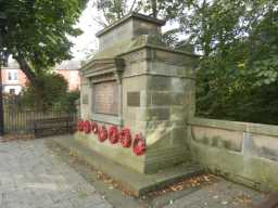 Oblique front right view of Fence Houses War Memorial with poppy wreaths January 2017